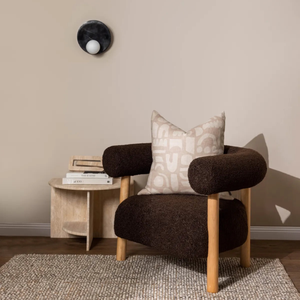 Black and White Marble Disc Wall Light next to a brown comfortable chair over a side table