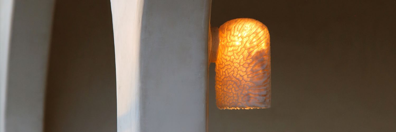 Fossil Coral Dome Wall Light In Situ Image On an Arch 