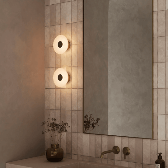 Circular glass bathroom wall light in a contemporary australian bathroom