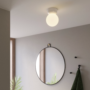 Glossy White Orb Ceiling Light in a modern bathroom close to the mirror