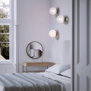 Elegant Plate and Crystal Ball Wall Light in a bedroom