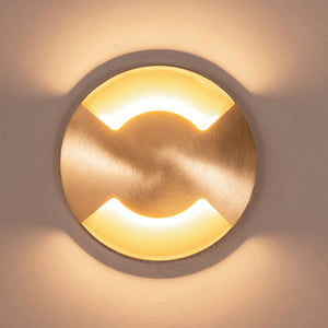 Modern Circular Up and Down TRI Colour Step Light brass finish front view lit up on the wall