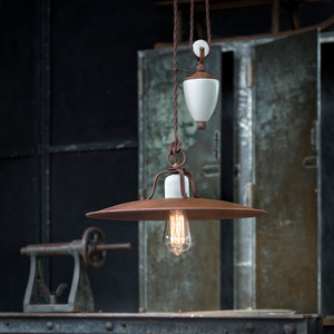 Crackled White and Rust Metal Rise & Fall Pendant Light in an industrial loft in the living room