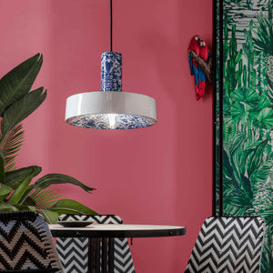 Chinese Ming Ceramic Pendant Light blue finish over a dining table in a colourful and modern restaurant