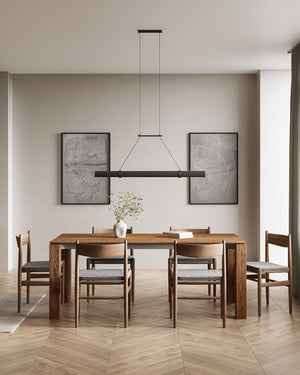Aluminium and Walnut Wood Cylindrical Linear Pendant | Lighting Collective | matte black and natural | over a dining table in a warm setting