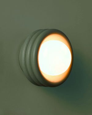 Round Rippled Wall Sconce with Glass Orb Diffuser in Dark Green Finish
