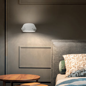 White Aluminium Decorated Dome Wall Light displayed as a bedside lamp