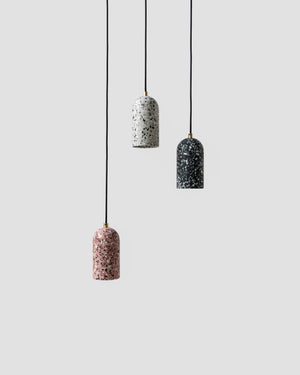 Three hanging Terrazzo lamps on a light grey background