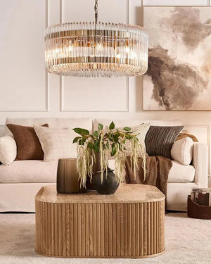 Modern living room with a chandelier, sofa, coffee table, Brass and Glass Loops Chandelier 