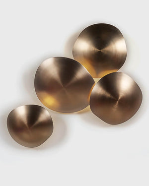 Set of four bronze circular wall sconces on a white background
