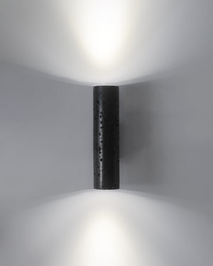 Cylindrical W01 Lava wall light fixture on a gray background