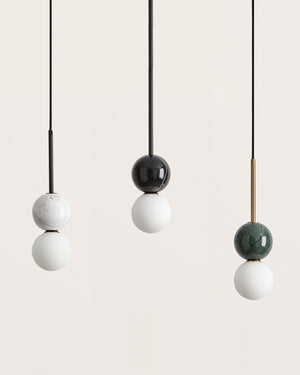 Set of three pendant lights with marble and frosted glass finishes 