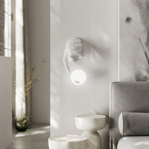 Playful Ceramic Cat Wall Light white finish near a sofa over a side table 