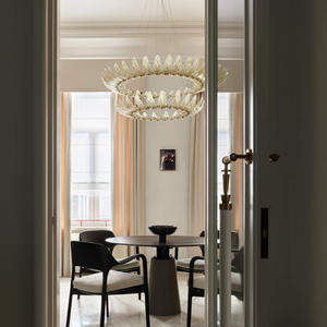 Satin Glass Leaf Chandelier in a dining room in an apartment 