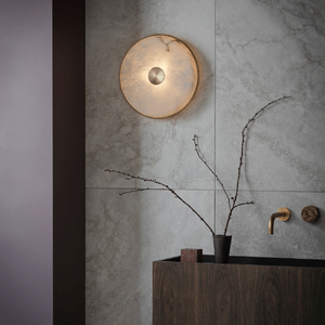 Elegant Alabaster Wall Light | Lighting Collective | antique brass finish near a sink