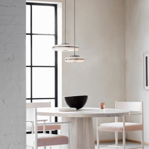 Elegant Alabaster Horizontal Pendant | Lighting Collective | nickel small and large in a dining room