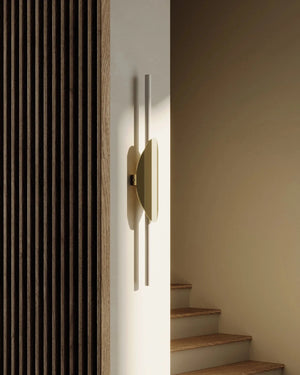 Elegant Elongated Tube Wall Light on a wall next to a stair case