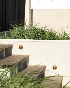 Eye Lid Outdoor Step Light | Assorted Finishes Brass by stairs