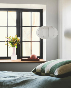 Fabric & Metal Pendant Light In a bedroom