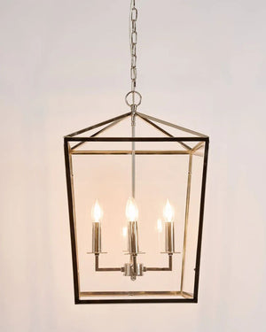 Hexagonal pendant light fixture with four candle-style lights on a plain background