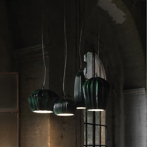 Glossy Green Ribbed Ceramic Pendant | Lighting Collective | cluster of four models in an industrial interior