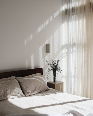 Handmade Ceramic Cylindrical Wall Light | Dawn In a bedroom