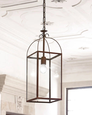 Decorative pendant light hanging from a ceiling with a white wall and window in the background.