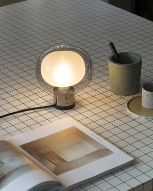 Layered Glass Short Table Lamp with a blackened chrome base and smoke coloured glass shade over a frosted glass orb