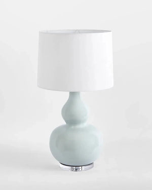 Ceramic Table lamp with a light blue base and white shade on a white background | Lighting Collective