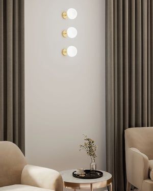 Three natural wall lights displayed in a modern reading nook