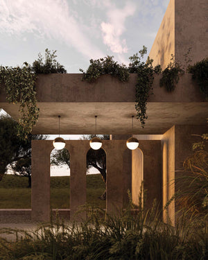 Three large brass dome pendant in an entrance way of a modern house
