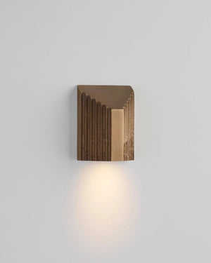 Modern wall light fixture on a gray background