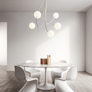 Minimalist Flexible Arm and Orb Chandelier | Lighting Collective | 5 arms in a dining room