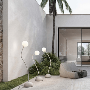 Minimalist Flexible Arm and Orb Outdoor Floor Lamp | Lighting Collective | on a modern terrace as a cluster