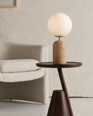 Minimalist Orb Travertine Table Lamp on a side table