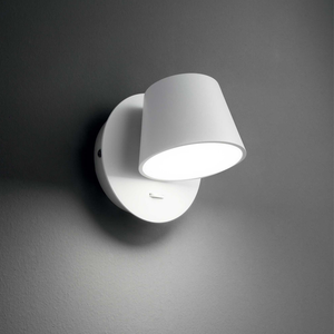 Modern Rotatable Aluminium Wall Light | Lighting Collective | white in a dark room