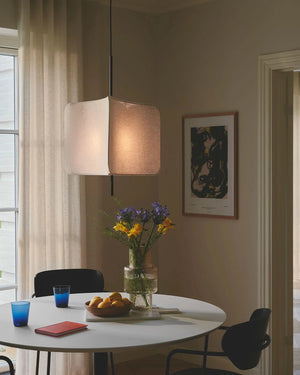 Dining room with a round table, chairs, and a Modern Triangular Fabric Pendant 