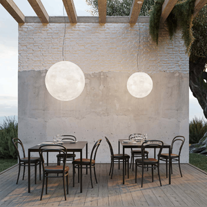 Outdoor Fibreglass Moon Pendant | Lighting Collective | small and large in an outdoor dining area