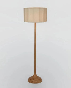 Wooden floor lamp with a beige shade on a light gray background