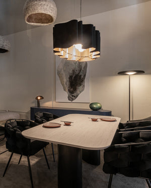 Pleated Oval Timber Pendant Hanging above a dining table