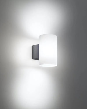Wall-mounted light fixture on a gray wall