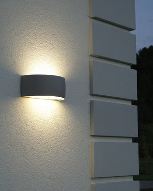 Semicircular Up Down Exterior Wall Light Installed on a modern home