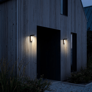 Solar Black Angled Wall Light | Lighting Collective | at a door entrance