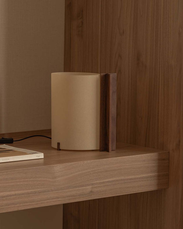 Timber base table lamp with papyrus shade on table switched off