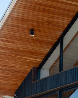 Wooden ceiling with a modern light fixture