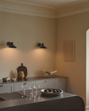 Modern kitchen with a island and two Scandinavian wall lights 