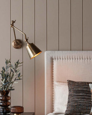 Adjustable Vintage Nickel Wall Light In a bedroom