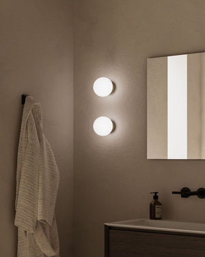 Architectural Orb Wall Sconce Styled in Modern Bathroom