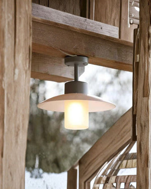 Shaded ceiling light with opal diffuser in barn