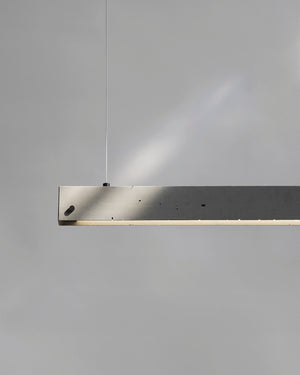Modern pendant light fixture on a gray background